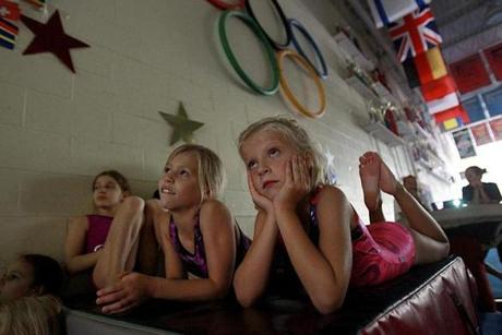 Katherine Mac Aulay and Ella Liljeeahl watched Thursday at Exxcel Gymnastics and Climbing in Newton as Aly Raisman competed in the women’s all-around final