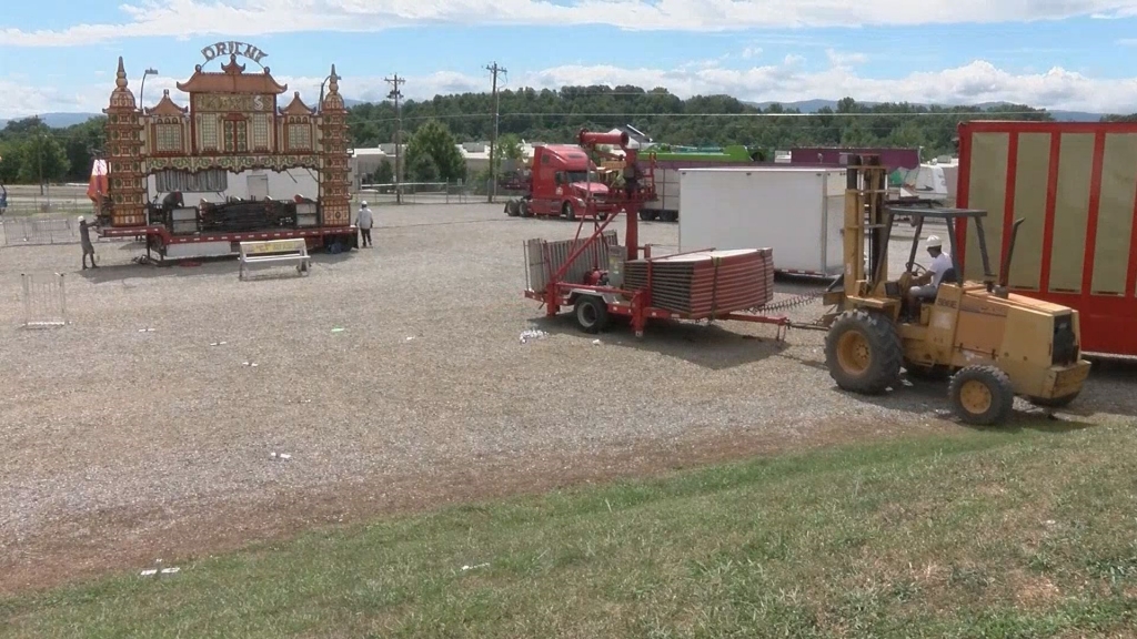 Workers tear down rides at the Greene County Fair on Thursday Aug. 11 2016