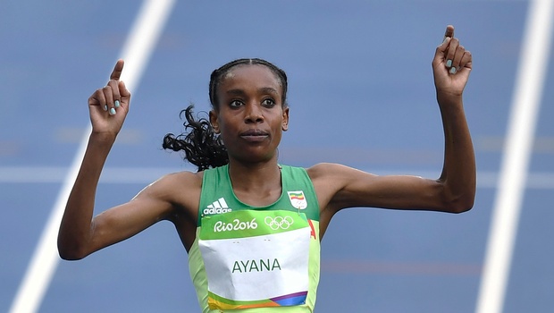 Ethiopia's Almaz Ayana celebrates winning the women's 10,000-meter final during the athletics competitions of the 2016 Summer Olympics at the Olympic stadium in Rio de Janeiro Brazil Friday Aug. 12 2016. | AP