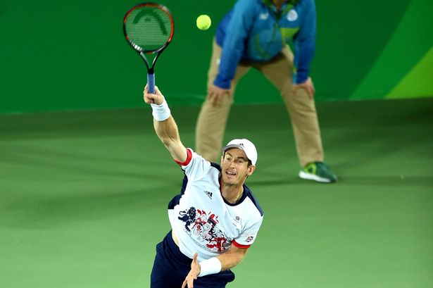 Andy Murray serves