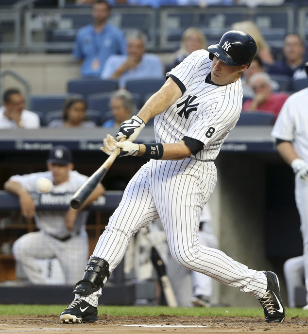 New York Yankees Mark Teixeira doubles during the first inning of the team's baseball game against the Cleveland Indians at Yankee Stadium Friday Aug. 5