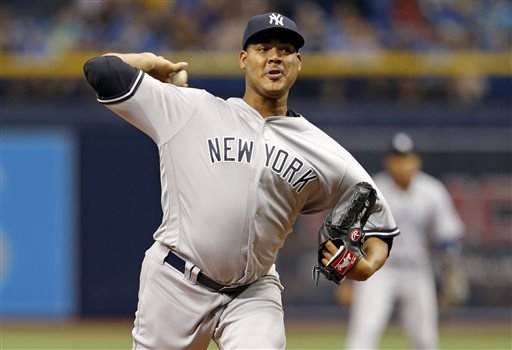 Yankees starting pitcher Ivan Nova throwing during the first inning of a baseball against the Tampa Bay Rays game in St. Petersburg Fla. The retooling New York Yankees have dealt right-hander Ivan Nova