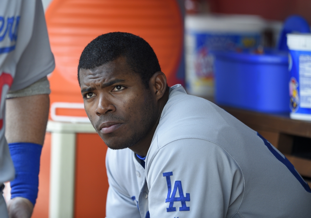 Dodgers&#039 Yasiel Puig looking on from the dugout during a baseball game against the Washington Nationals in Washington. Puig's agent said Monday Aug. 1 2016 the Los Angeles Dodgers slugger