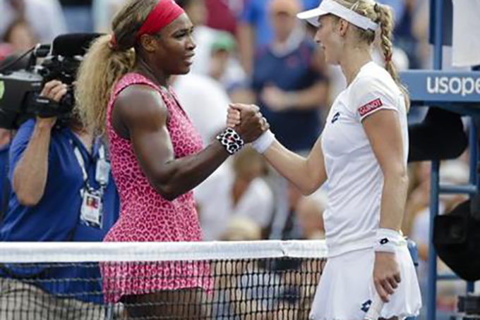 Serena Williams left greets Ekaterina Makarova of Russia after winning their semifinal match of the 2014 U.S. Open tennis tournament in New York