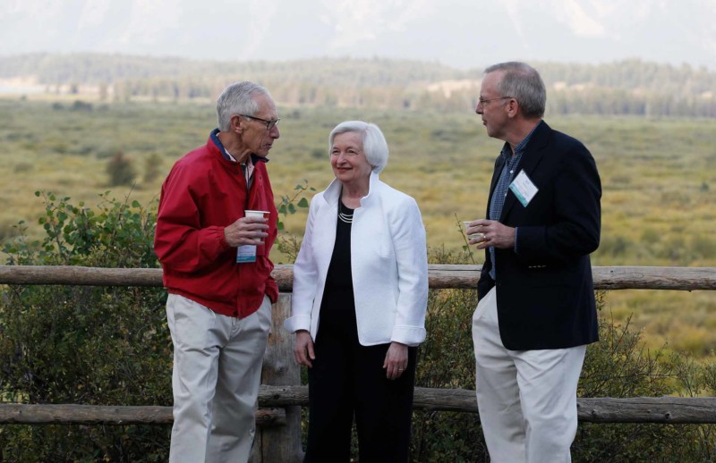 Federal Reserve Chair Janet Yellen center Stanley Fischer left vice chairman of the Board of Governors of the Federal Reserve System and Bill Dudley the president of the Federal Reserve Bank of New York stroll together before Yellen's speech