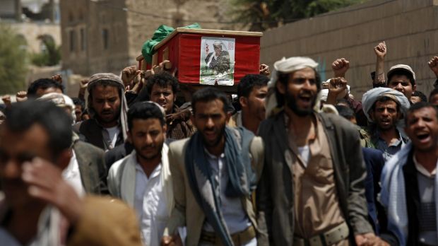 Shiite rebels known as Houthis carry the coffin of a fellow Houthi who was killed during fighting against