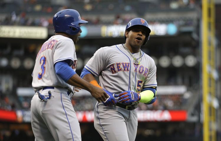 Yoenis Cespedes celebrates as his home run is the difference in Sunday's win over the Giants