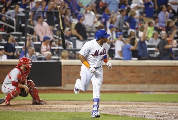 Yoenis Cespedes flips his bat after blasting a mammoth three-run home run in the fourth inning