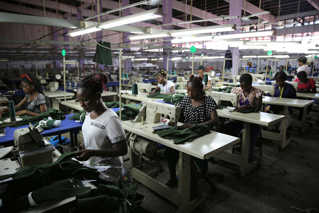 Young factory workers producing shirts in Accra Ghana