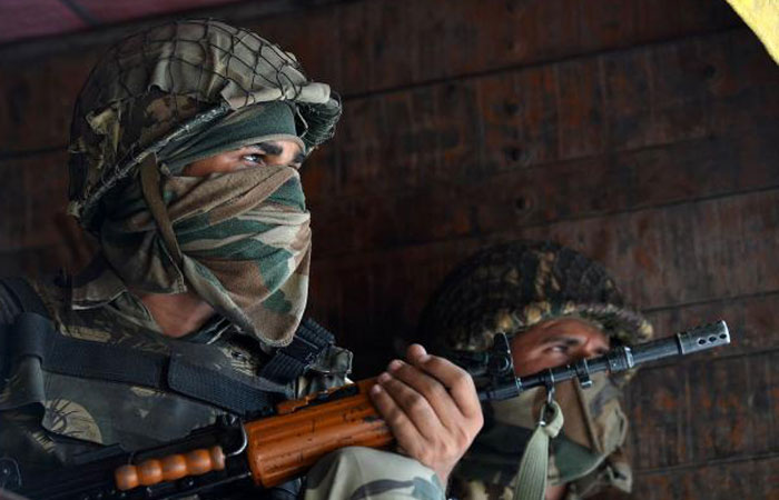 Indian Border Security Force soldiers sit inside a truck upon arrival with others in Srinagar on Tuesday to join thousands of federal forces and local policemen already deployed in the Kashmiri capital to contain a 46-day-old unrest. — AFP