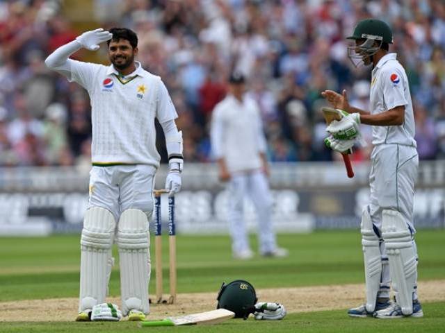 Younus Khan applauds as Azhar Ali celebrates reaching his century at Edgbaston in Birmingham