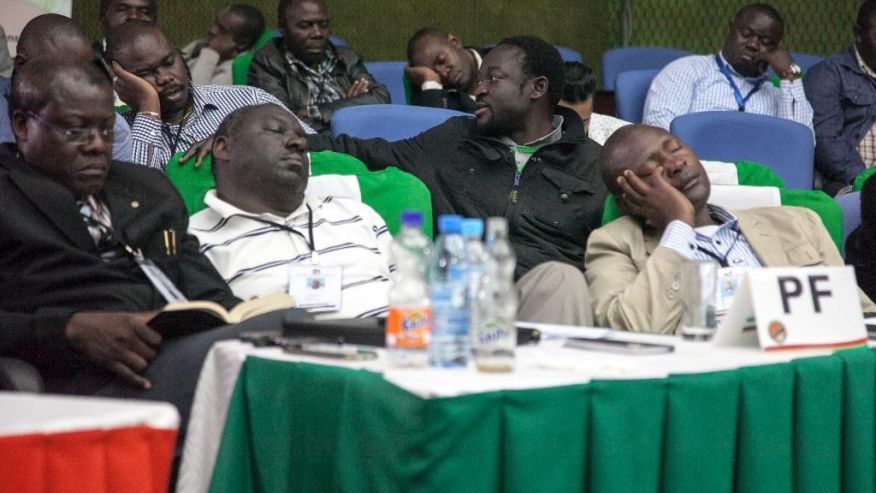 Officials of the ruling party nap as they await results of the presidential elections in Lusaka Monday Aug. 15 2016. Zambia's president Edgar Lungu led Monday in nearly complete results from an election whose vote-counting process has taken days