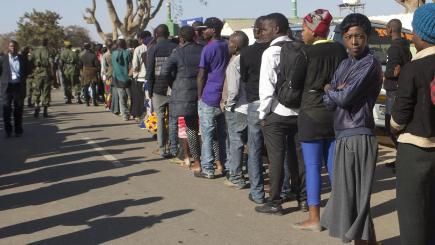 Zambians queue to vote in Lusaka in a tight election race for president and parliament