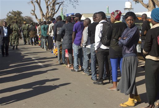 Zambians queue to cast their votes at a polling station in Lusaka Thursday Aug. 11 2016 in a tight election race for president and parliament. The election campaign has been marred by violence between rival factions but there are no early reports