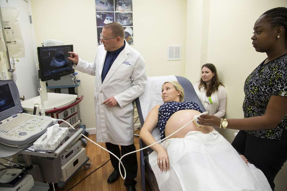 Dr. Aaron Elkin checks fetal size on Samantha Flax’s sonogram in Hollywood Fla. Aug. 12 2016. Flax and her sister Brittany Schuman who is also pregnant are both concerned about the Zika virus. As Zika updates stir new worries pregnant women are