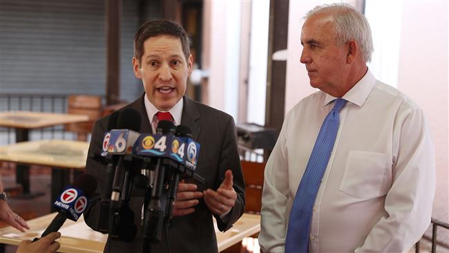 Director of the CDC Dr. Tom Frieden stands with Miami Dade county mayor Carlos Gimenez as they speak to the media about the outbreak of the Zika virus during a visit to the Wynwood neighborhood