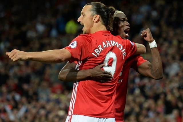 Zlatan Ibrahimovic celebrates with teammates after scoring their first goal