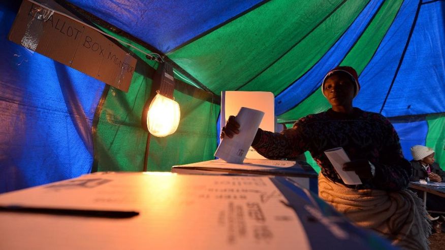 A woman casts her vote at a polling station in Atteridgeville Pretoria South Africa Wednesday Aug. 3 2016. South Africans are voting in municipal elections in which the ruling African National Congress seeks to retain control of key metropolitan areas