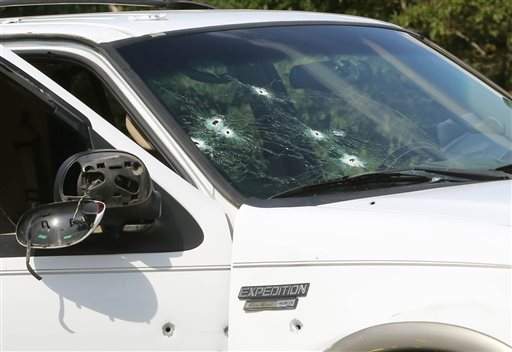 1 dead, 4 hurt in highway shootout; bullet holes cover SUV