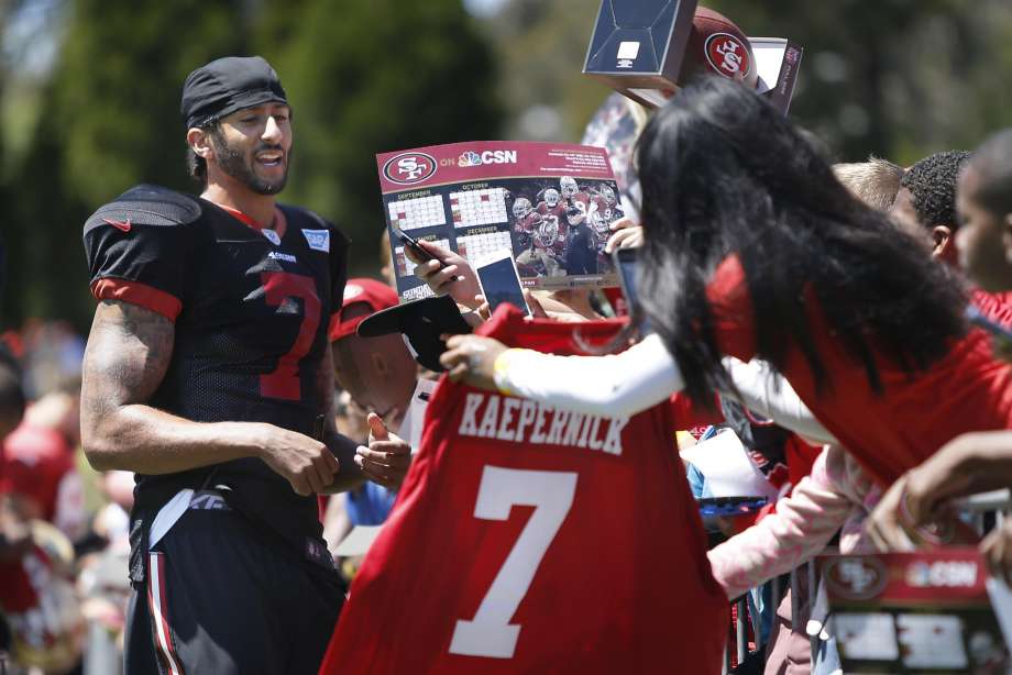 Colin Kaepernick signs autographs after practice Wednesday at Kezar Stadium