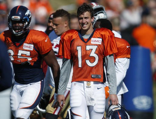 Denver Broncos quarterback Trevor Siemian takes a break during drills with the San Francisco 49ers at the teams NFL football training camp session Wednesday Aug. 17 2016 in Englewood Colo. The Broncos host San Francisco on Saturday in an NFL exhibitio