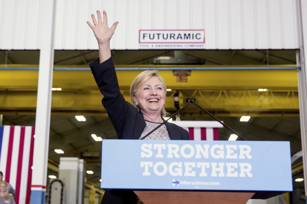 Democratic presidential candidate Hillary Clinton waves as she finishes a speech on the economy after touring Futuramic Tool & Engineering in Warren Mich. Thursday Aug. 11 2016