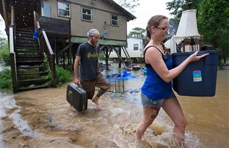 Getting out ahead of the flood Michael Tramonte and Nikki Conger clear their possessions from their house on Watters Road south of Hwy. 22 and east of Pontchatoula La. ahead of the coming flooding Tangipahoa River as storms pound Tangipahoa Parish Fr