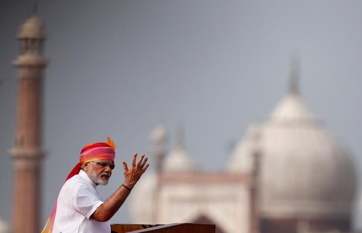 Indian Prime Minister Narendra Modi gestures as he addresses the nation from the historic Red Fort during Independence Day celebrations in Delhi