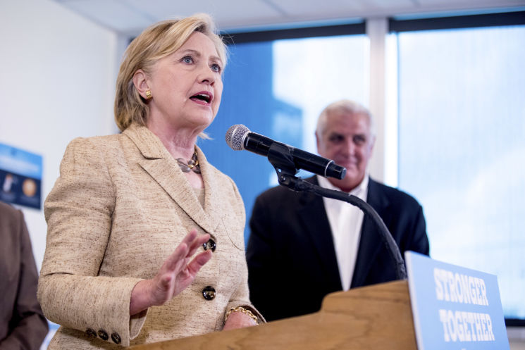 Democratic presidential candidate Hillary Clinton speaks to medical professionals after taking a tour of Borinquen Health Care Center in Miami on Tuesday to see how they are combatting Zika