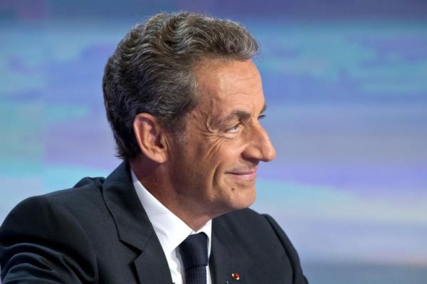 Former French President Nicolas Sarkozy poses prior