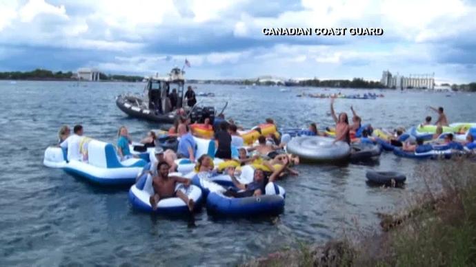 Wind blows Americans in Port Huron Float Down across to Canada