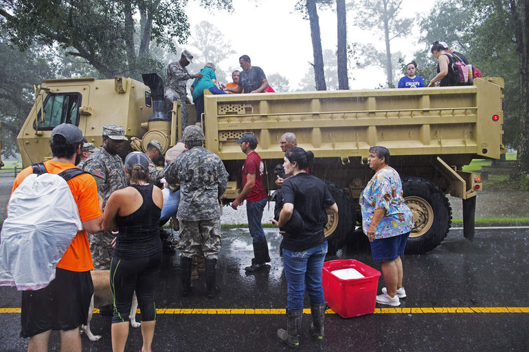 Members of the Louisiana Army National Guard rescue people