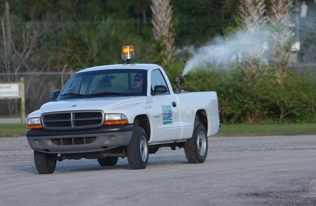 A St. Lucie County Mosquito Control truck turns on its sprayer as it heads out from the compound in Fort Pierce on an evening run in St. Lucie County in 2002