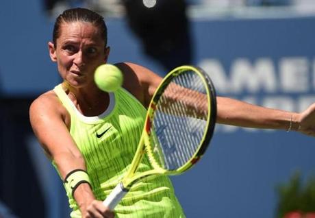 Roberta Vinci of Italy hits a return against Anna Lena Friedsam of Germany during their 2016 US Open Women's Singles match at the USTA Billie Jean King National Tennis Center