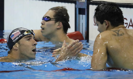 United States Michael Phelps left congratulates Singapore's Joseph Schooling for his gold in the men's 100-meter butterfly final during the swimming competitions at the 2016 Summer Olympics Friday Aug. 12 2016 in Rio