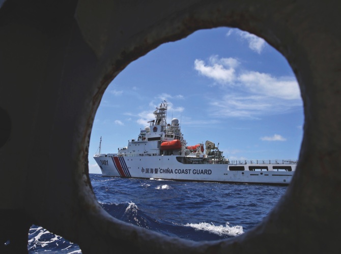 A Chinese Coast Guard ship attempts to block a Philippine government vessel as the latter tries to enter Second Thomas Shoal in the South China Sea