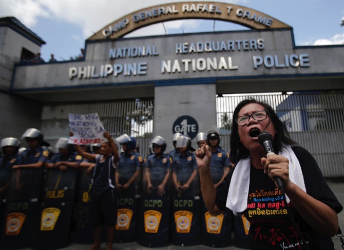 A Filipino activist shouts slogans calling for an end to extrajudicial killings related to Philippine President Rodrigo Duterte’s “War on Drugs”