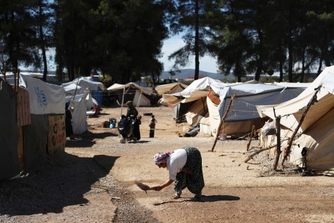 The Latest: Afghan migrants found hiding in trucks in Serbia