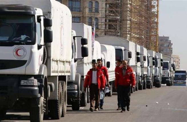 A Red Crescent convoy prepares to leave the Syrian capital Damascus to the besieged areas of Aleppo