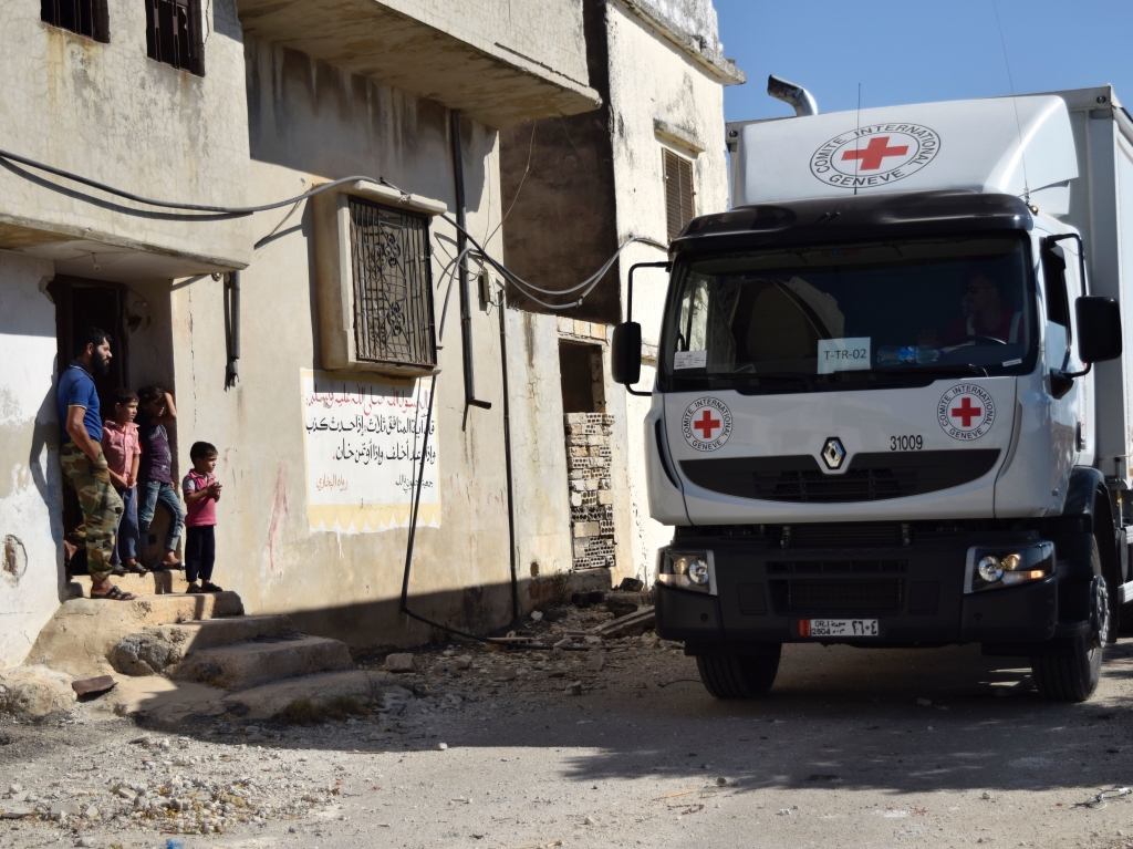 A Red Cross vehicle carrying aid arrives in the rebel-held town of Talbiseh Syria on Monday