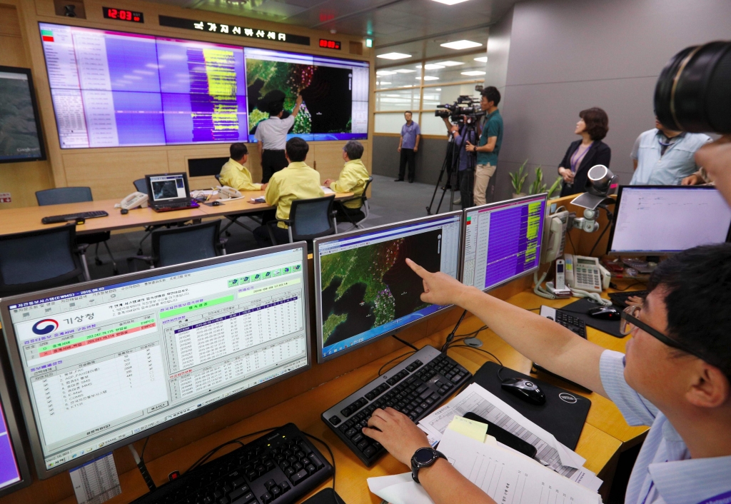 A South Korean official points to a map showing the epicentre of seismic waves caused by North Korea’s largest nuclear test Getty Images