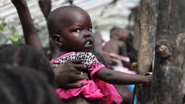 A baby in the queue for food at a camp for displaced people near the United Nations base in Juba South Sudan