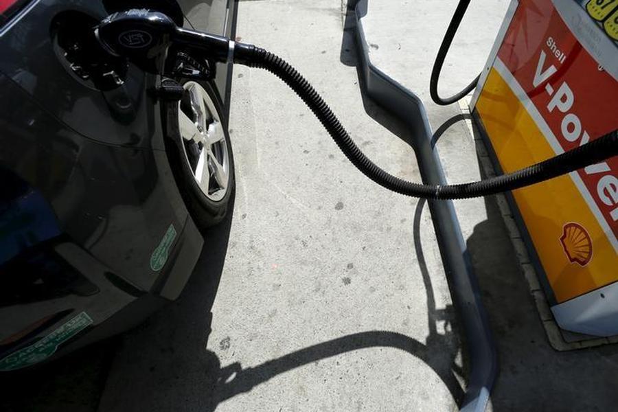 A car is filled with gasoline at a gas station pump in Carlsbad California