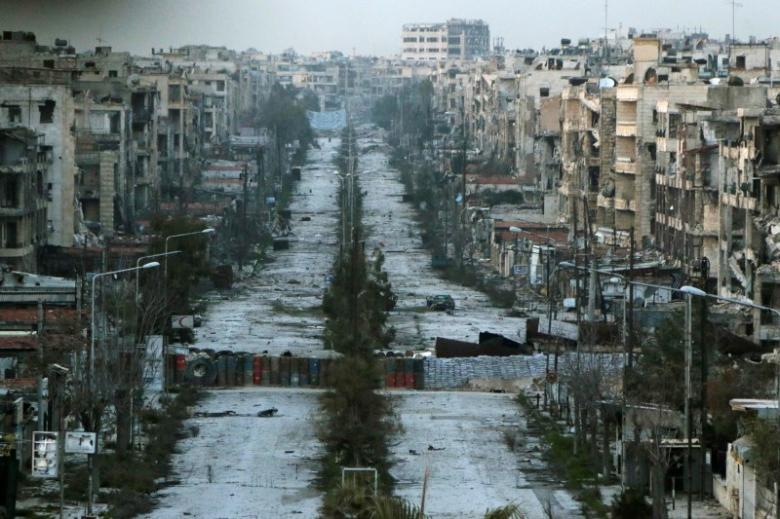 A general view shows a damaged street with sandbags used as barriers in Aleppo's Saif al Dawla district Syria