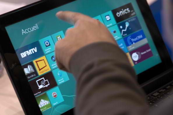 A man navigates with Windows 8 on a Tablet