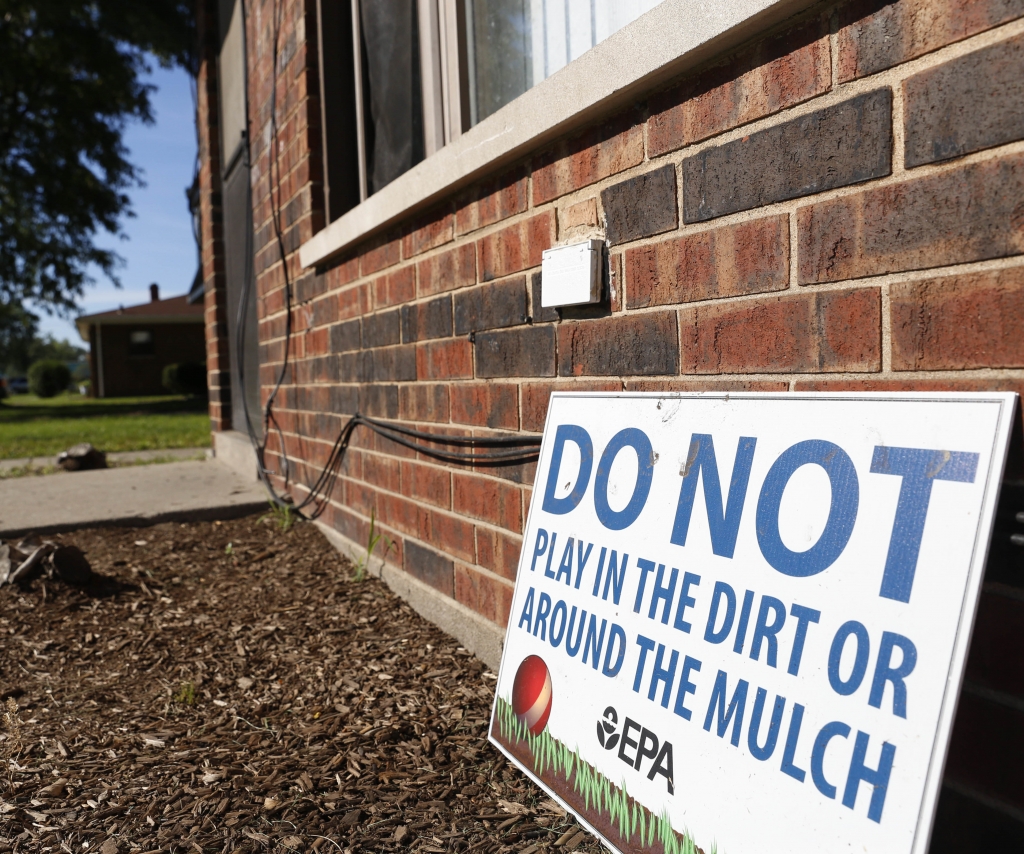 A sign from the Environmental Protection Agency posted in front of West Calumet Housing Complex houses in East Chicago Ind