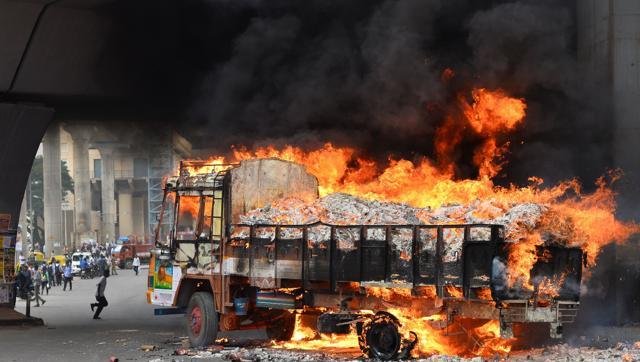 A truck from Tamil Nadu burns after it was set alight by agitated pro Karnataka activists in Bengaluru