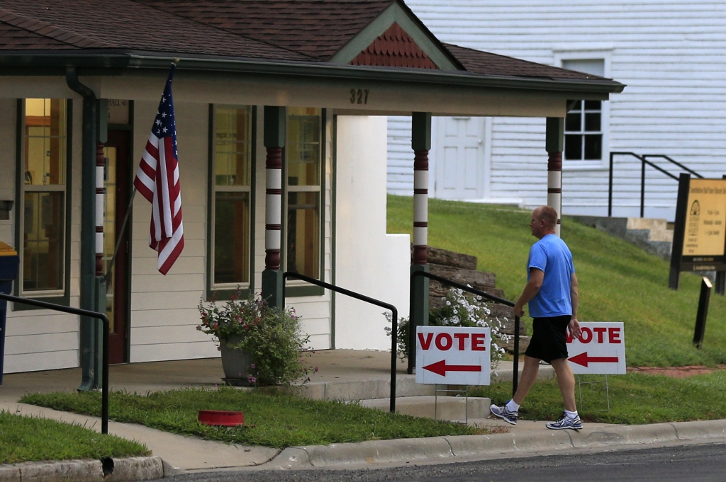 A voter enters city hall in Lecompton Kan. to vote in the state's primary election last month