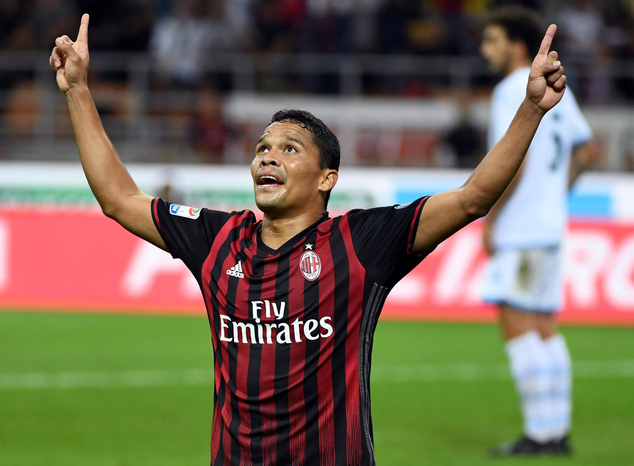 AC Milan's Carlos Bacca celebrates after scoring during the Serie A soccer match between AC Milan and Lazio at the San Siro stadium in Milan Italy Tuesday