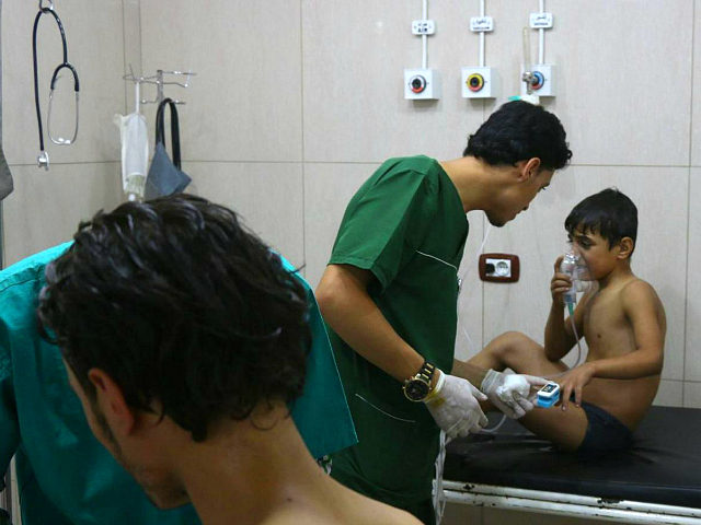 SYRIA ALEPPO: Doctors treat Syrians suffering from breathing difficulties at a make-shift hospital in Aleppo after regime helicopters dropped barrel bombs on the rebel-held Sukkari neighbourhood of the northern Syrian city